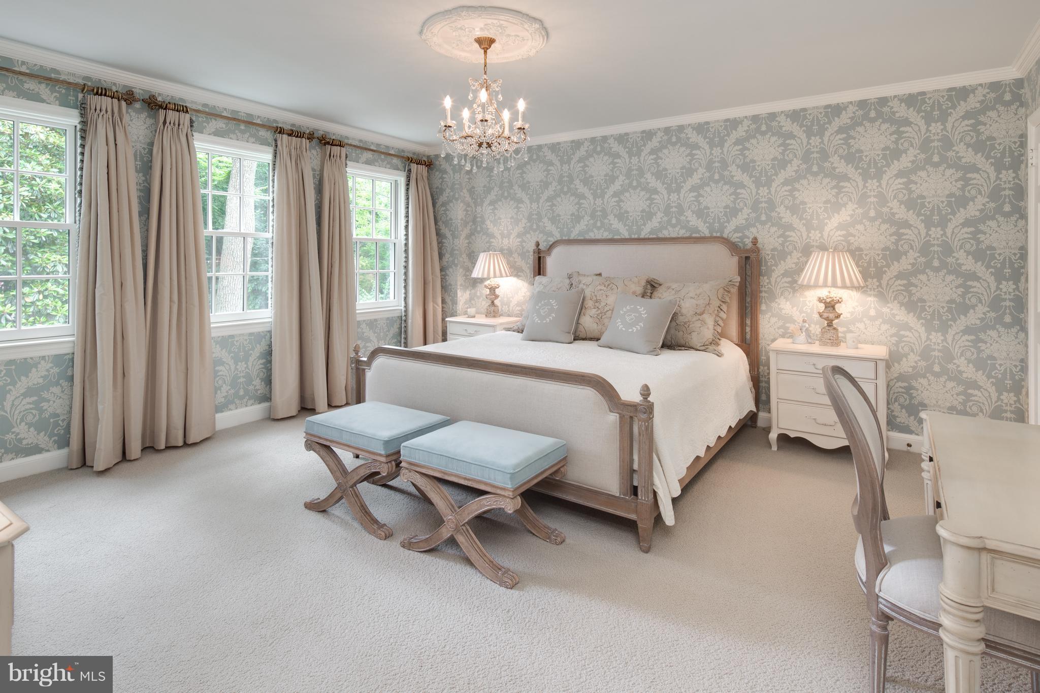 2814 R Street Northwest Washington, DC 20007 - Photo 14 of 30 a bedroom with a bed and a chandelier