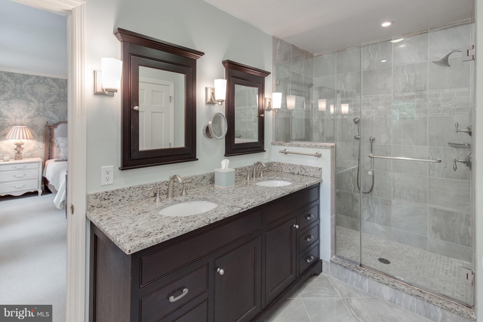 2814 R Street Northwest Washington, DC 20007 - Photo 17 of 30 a bathroom with a granite countertop sink and a mirror