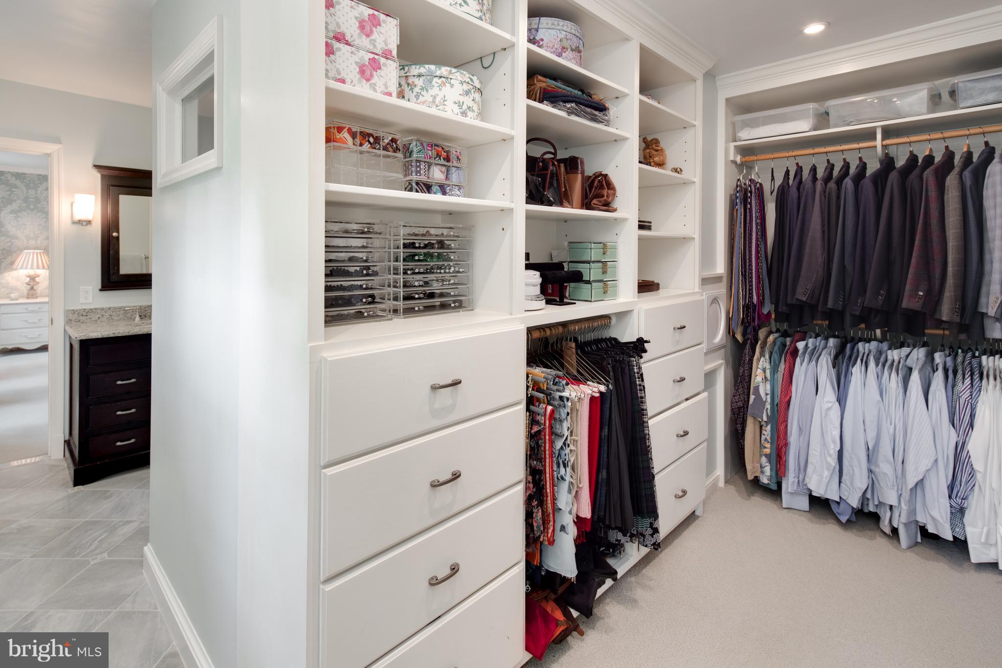 2814 R Street Northwest Washington, DC 20007 - Photo 18 of 30 a view of walk in closet with clothes and shoes