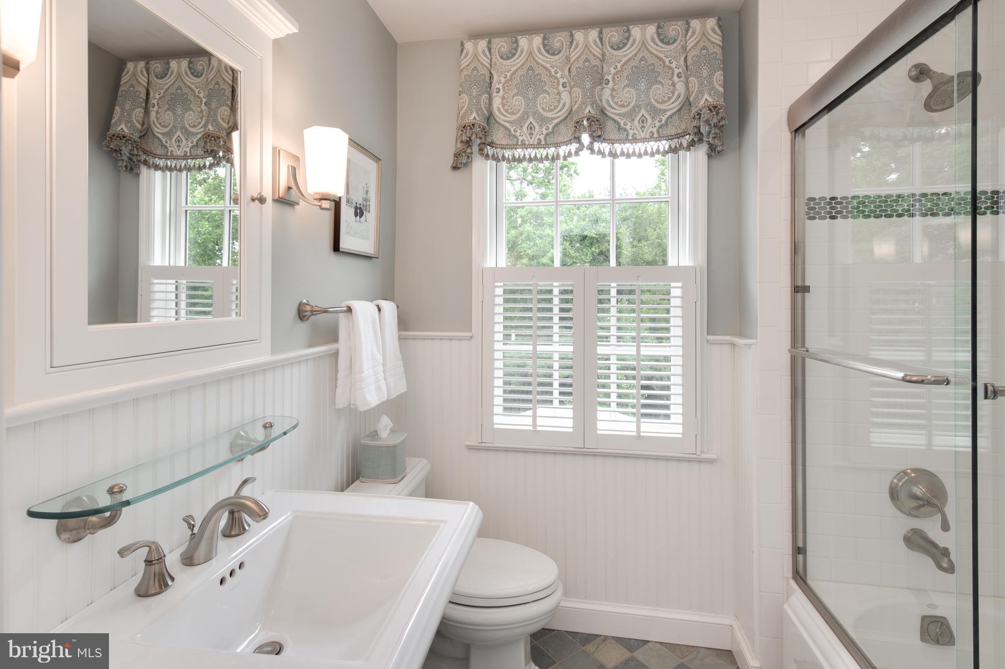 2814 R Street Northwest Washington, DC 20007 - Photo 21 of 30 a bathroom with a sink and a window