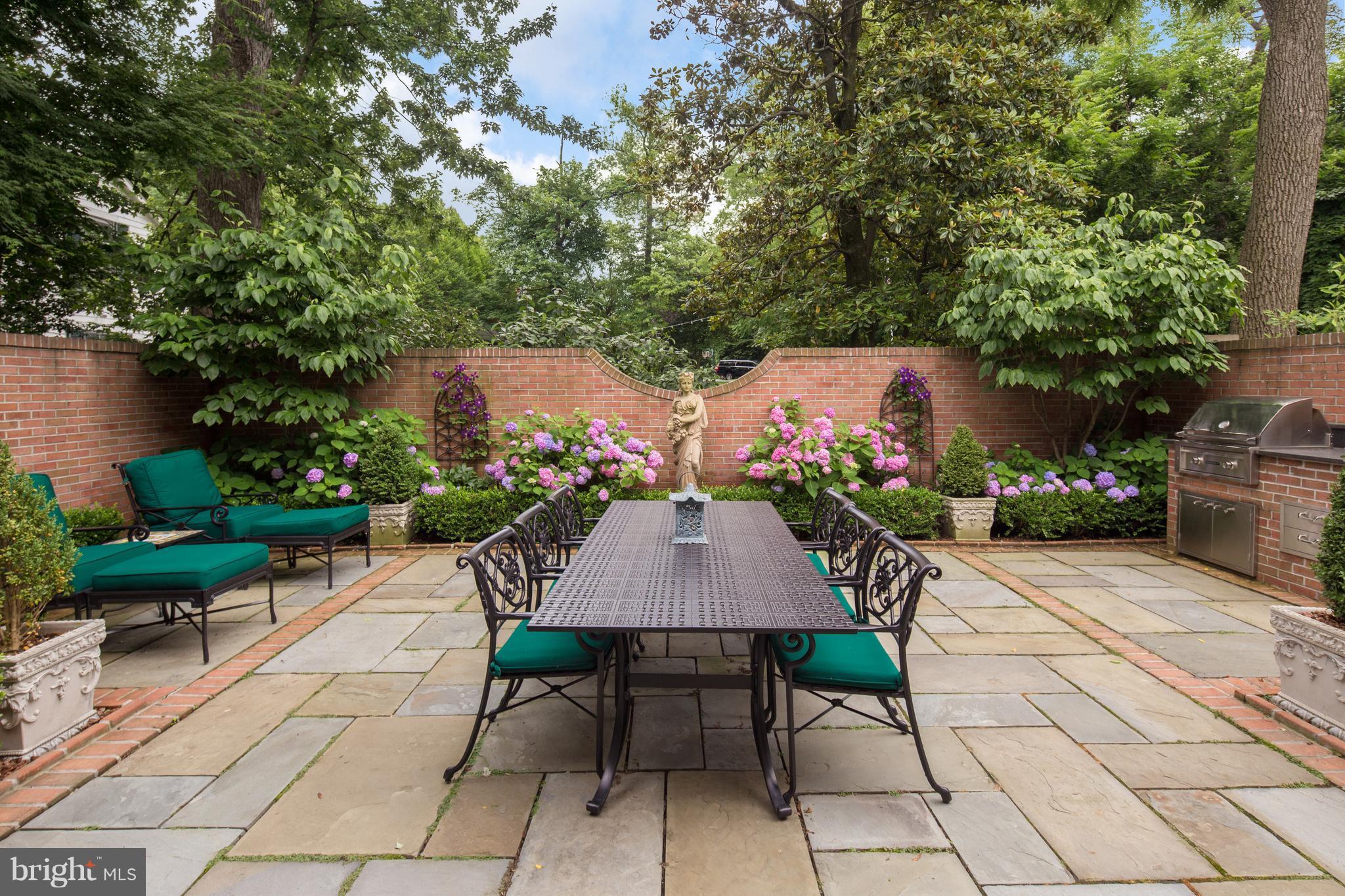 2814 R Street Northwest Washington, DC 20007 - Photo 25 of 30 a patio with table and chairs potted plants and a large tree