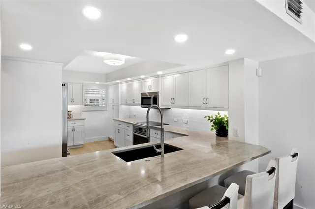 a kitchen with a table and chairs