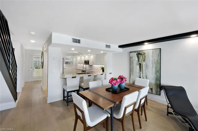 a kitchen with a table and chairs in it