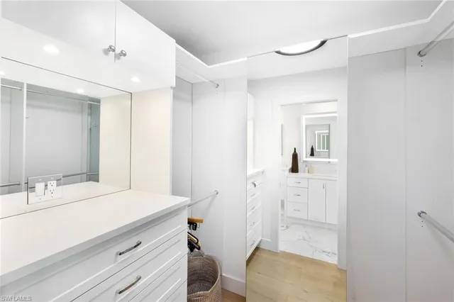 a spacious bathroom with a double vanity sink and a mirror