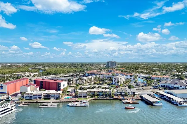 a view of swimming pool with outdoor seating and city view