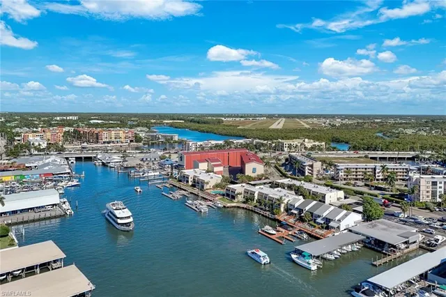 a view of a yard with furniture and a garden