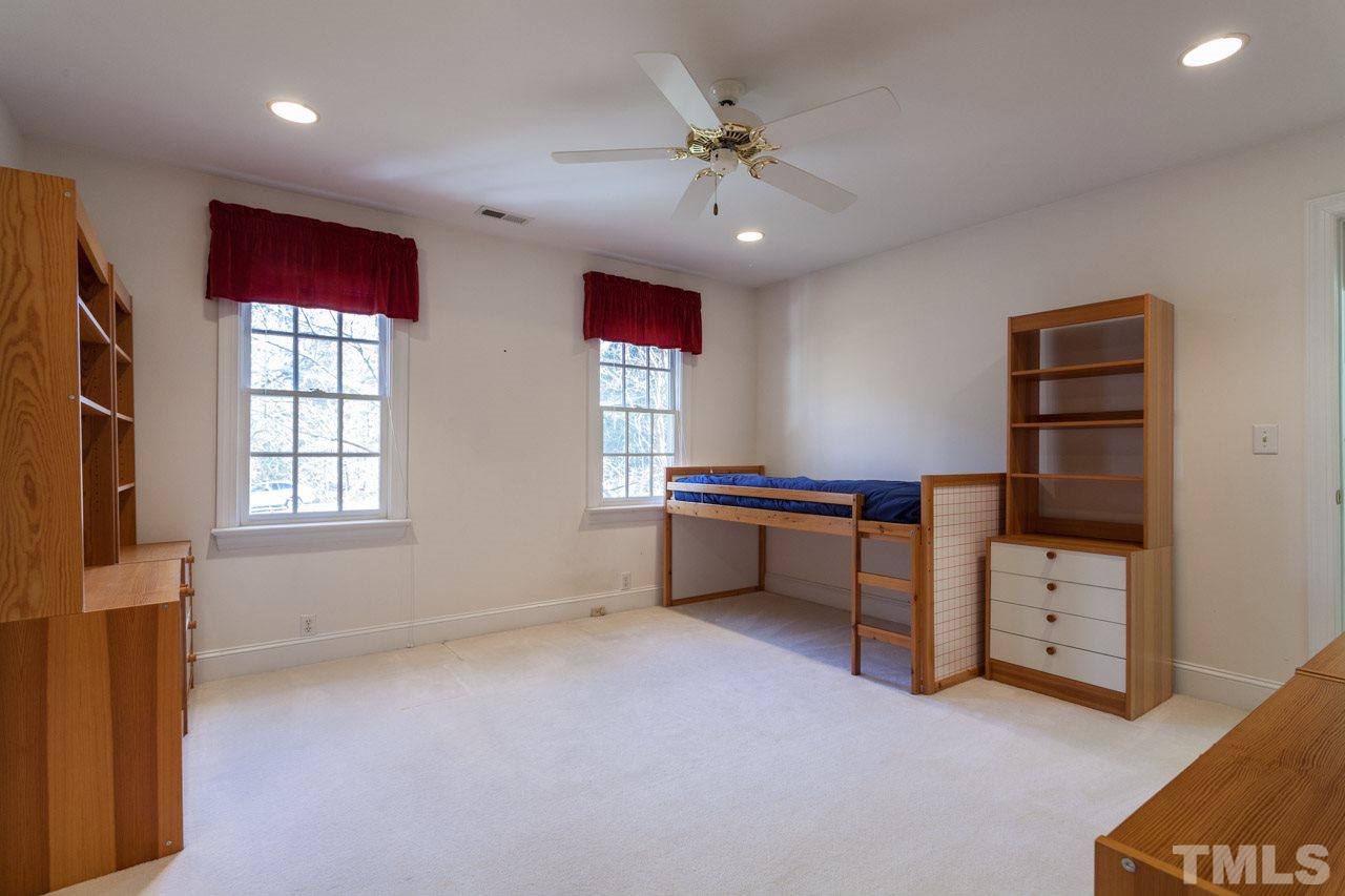 4000 White Chapel Way Raleigh, NC 27615 - Photo 18 of 25 Sunny bedroom facing the landscaped front of the home also shares the jack and jill bathroom.