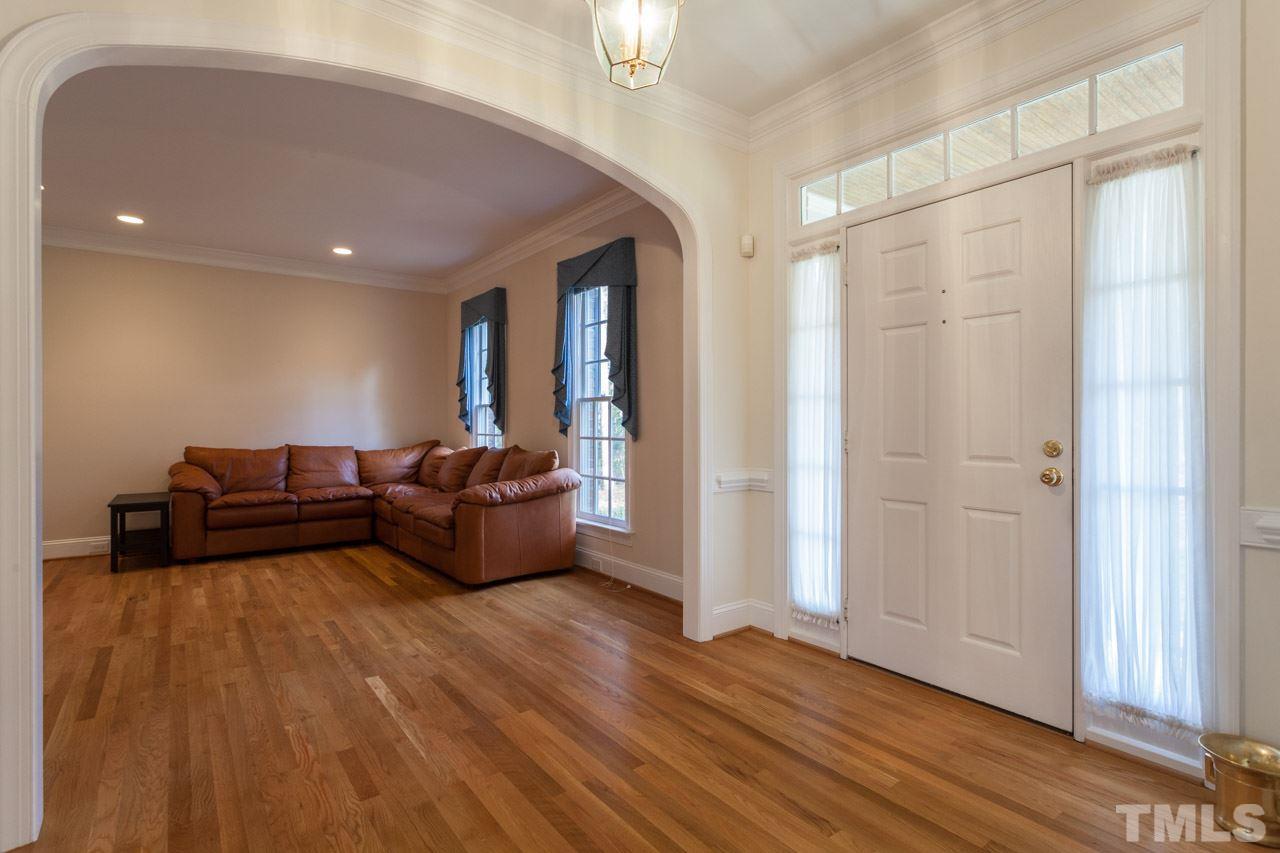 Step inside to your open foyer and gleaming wood floors.