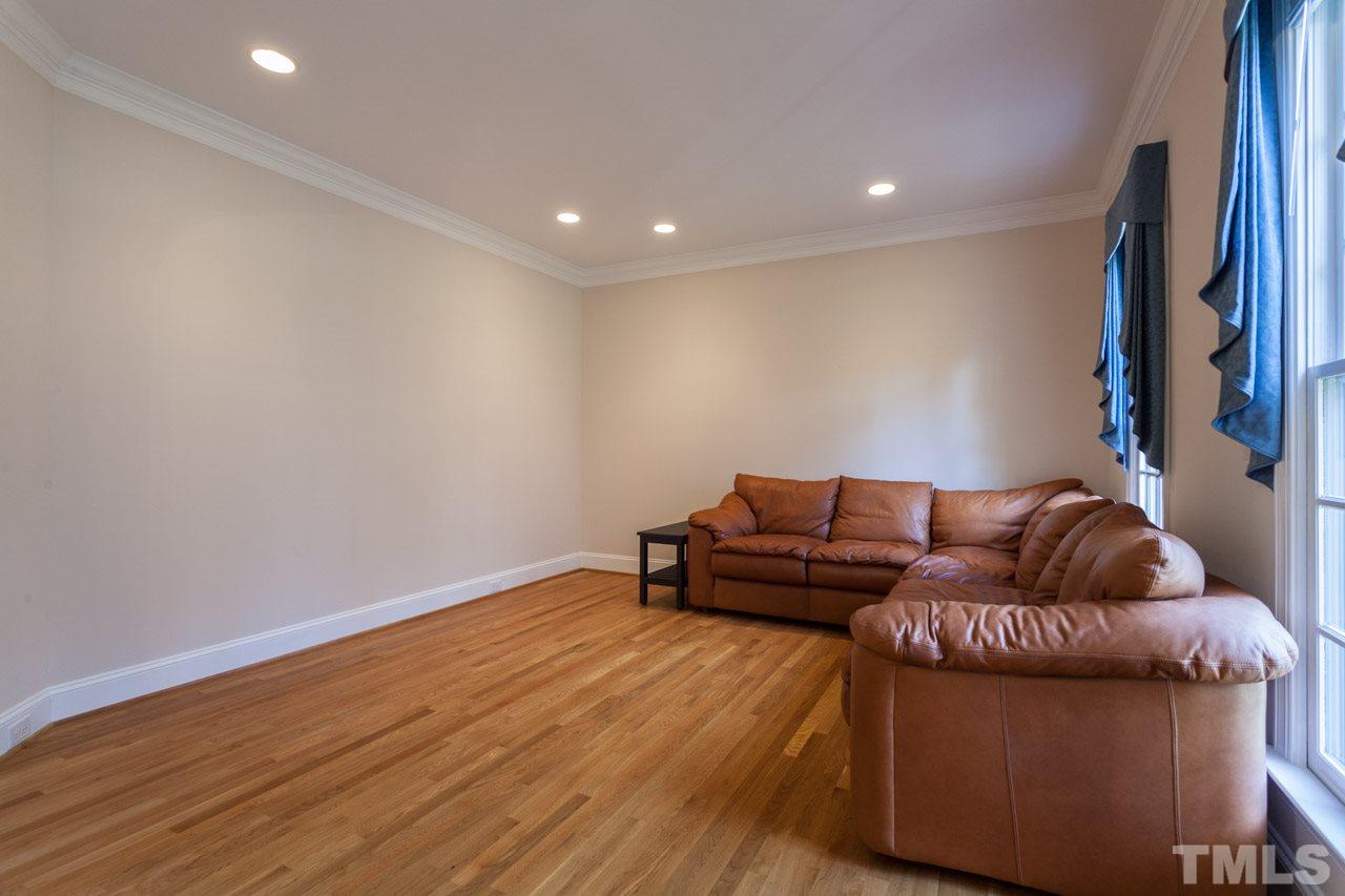 Formal living room overlooking your landscaped front yard.
