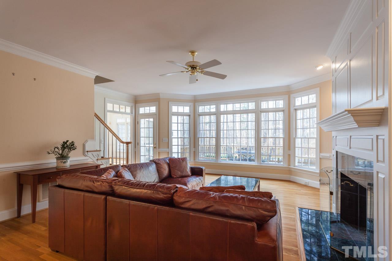 Perfect spot for entertaining or just enjoying the view from the expansive windows out toward your private pool, hot tub, deck and wooded property.