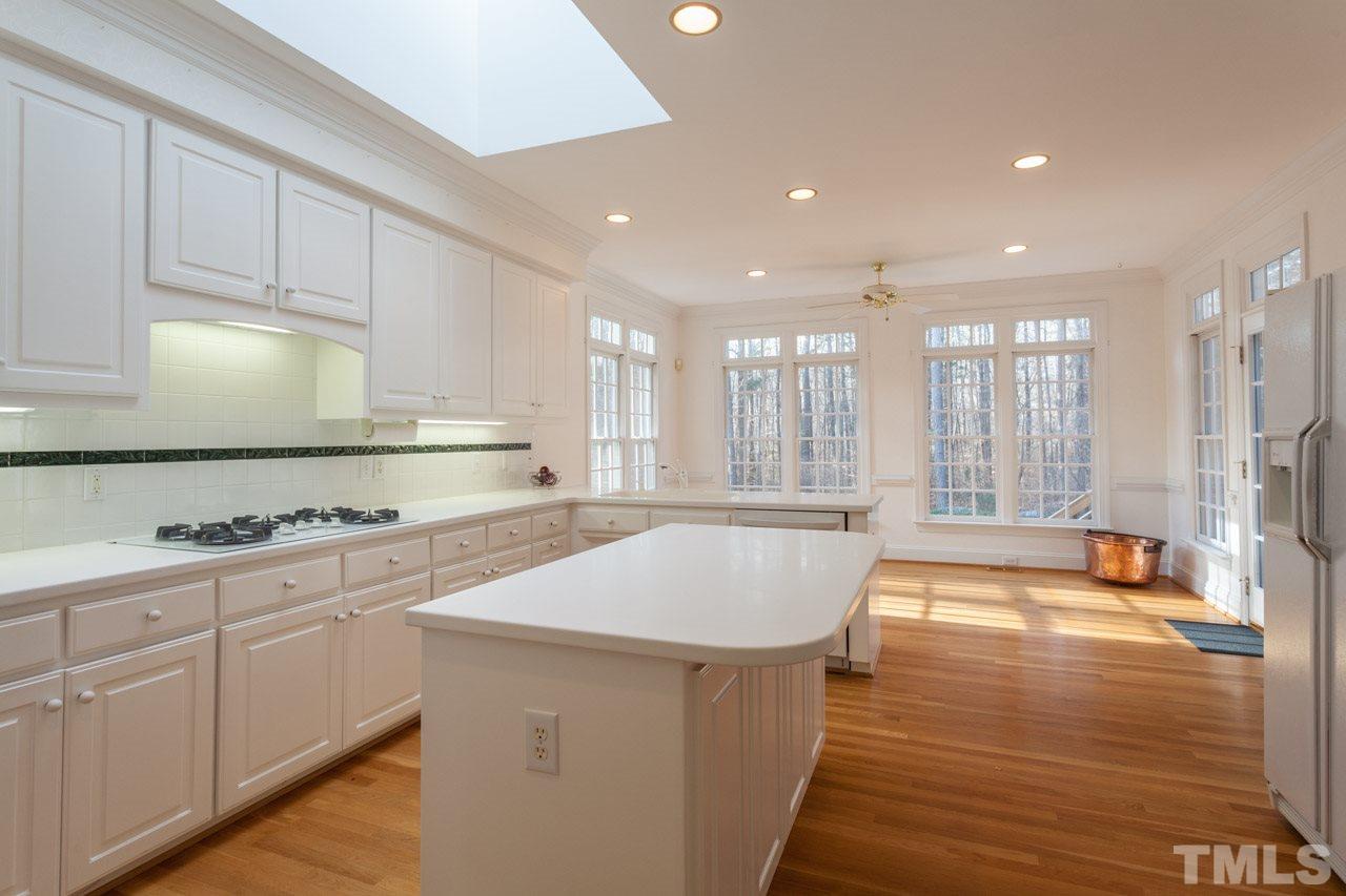 4000 White Chapel Way Raleigh, NC 27615 - Photo 10 of 25 The island, expansive cabinetry, desk area and pantry gives you ample room for all of your dining needs.