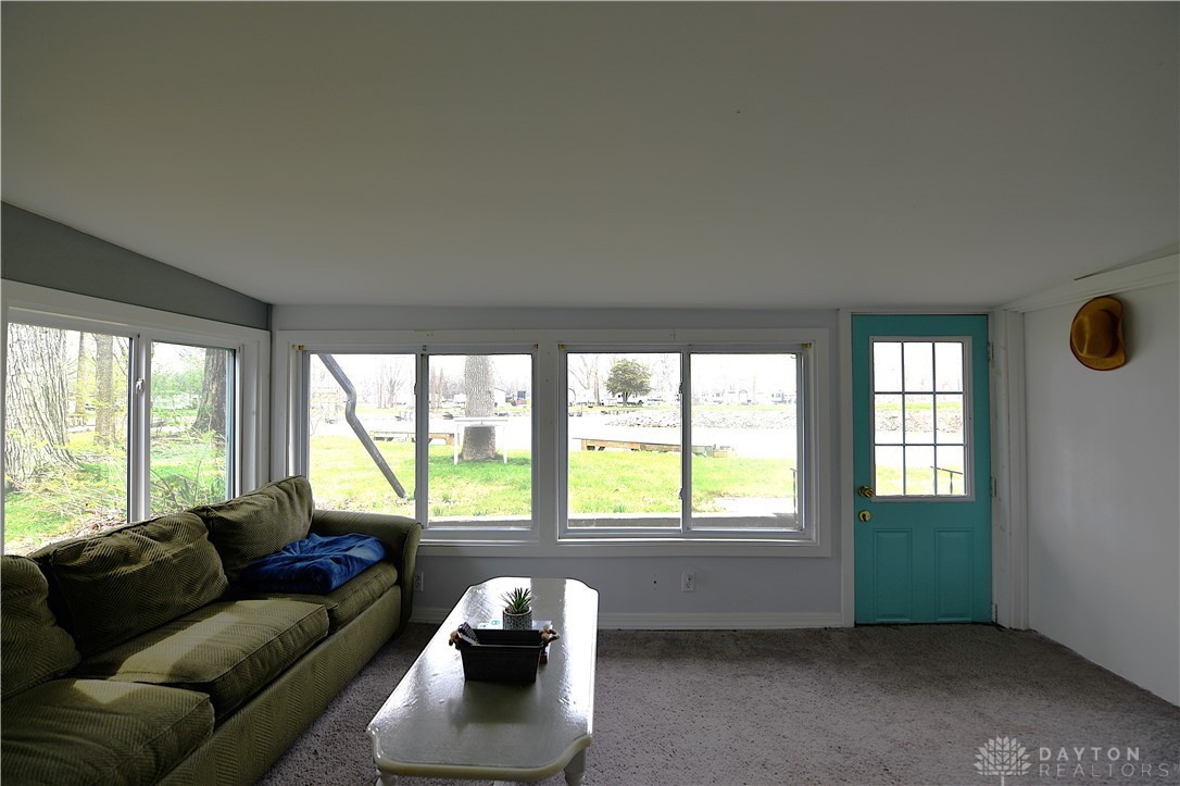 5445 Behm Road, Unit 15 Celina, OH 45822 - Photo 14 of 49 This bright living area features expansive windows offering scenic waterfront views.