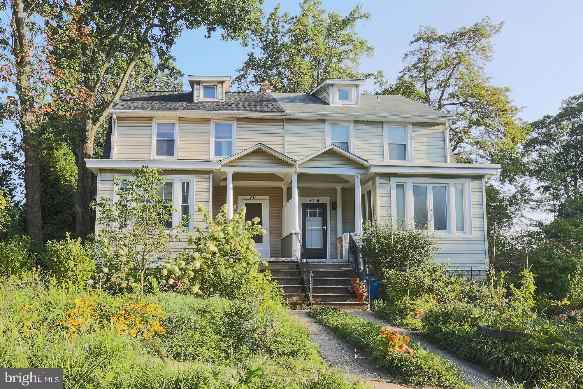 616 St Johns Road Baltimore, MD 21210 - Photo 1 of 15 a front view of a house with a yard and trees