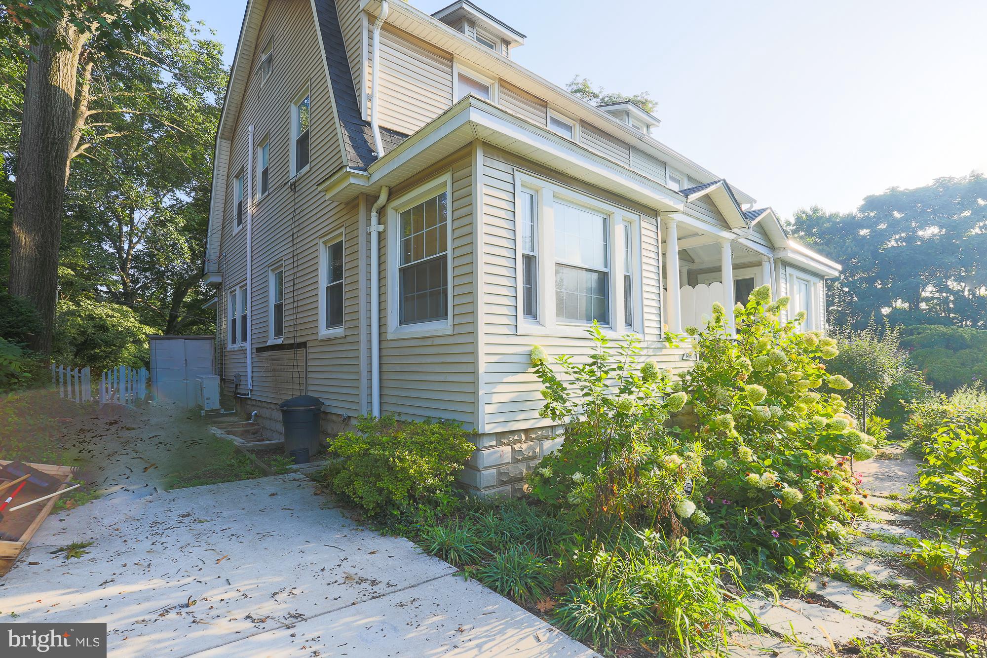 616 St Johns Road Baltimore, MD 21210 - Photo 2 of 15 a view of a brick house with a yard