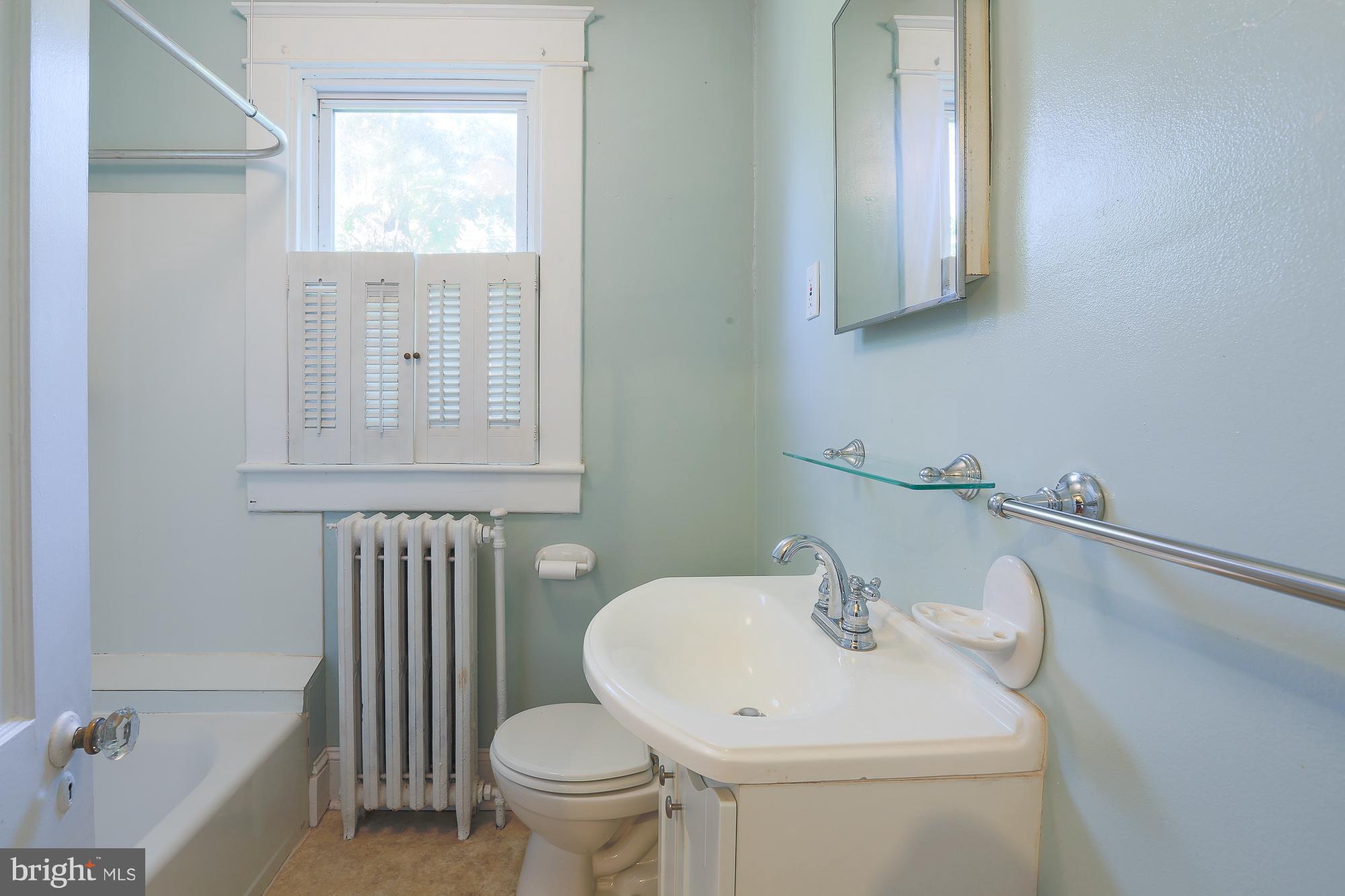 616 St Johns Road Baltimore, MD 21210 - Photo 12 of 15 a bathroom with a sink a toilet and shower