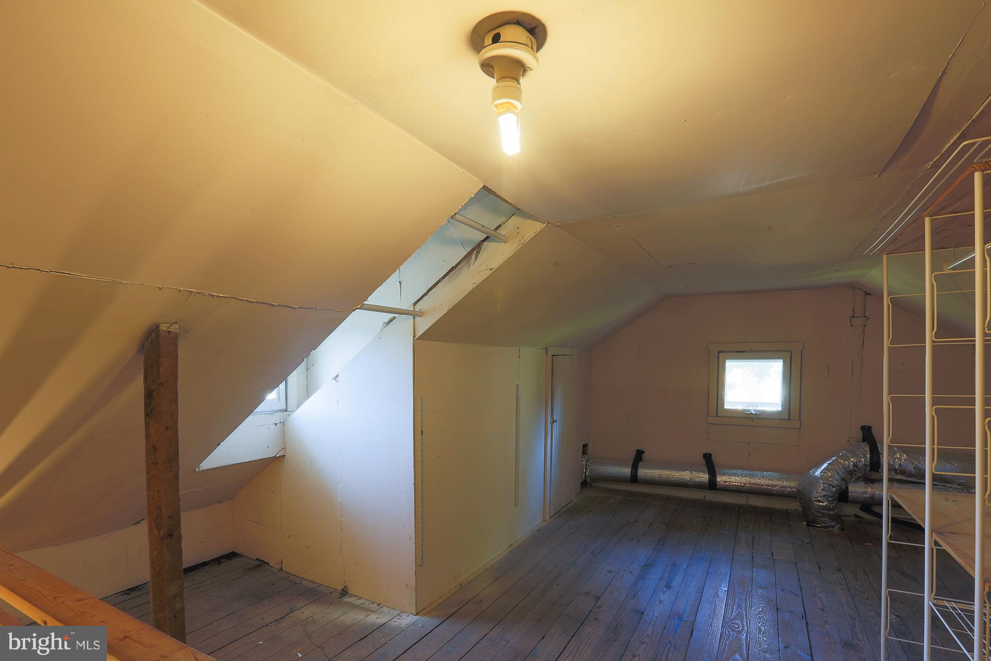 616 St Johns Road Baltimore, MD 21210 - Photo 14 of 15 a view of empty room with wooden floor and fan