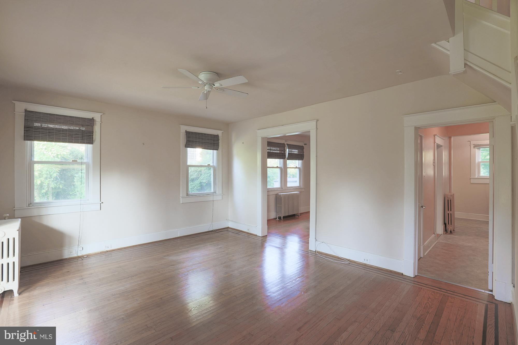 616 St Johns Road Baltimore, MD 21210 - Photo 4 of 15 wooden floor in an empty room with a window