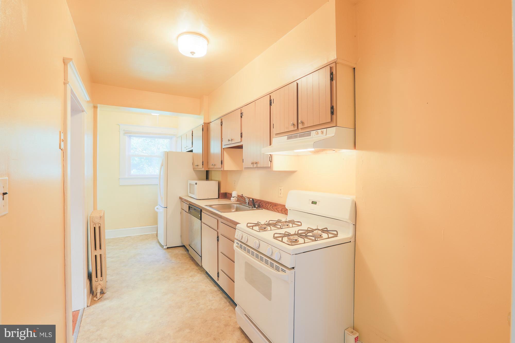 616 St Johns Road Baltimore, MD 21210 - Photo 8 of 15 a kitchen with a stove and a refrigerator