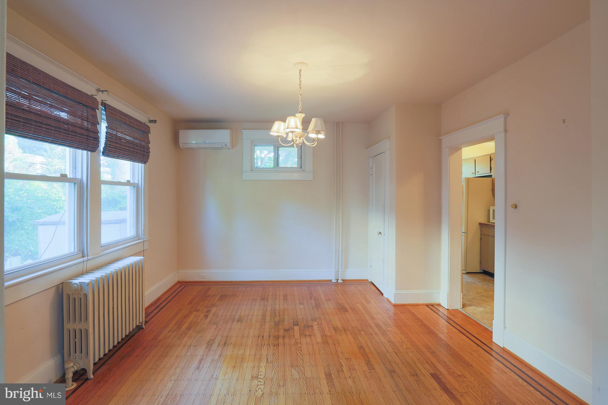 616 St Johns Road Baltimore, MD 21210 - Photo 9 of 15 wooden floor in an empty room with a window