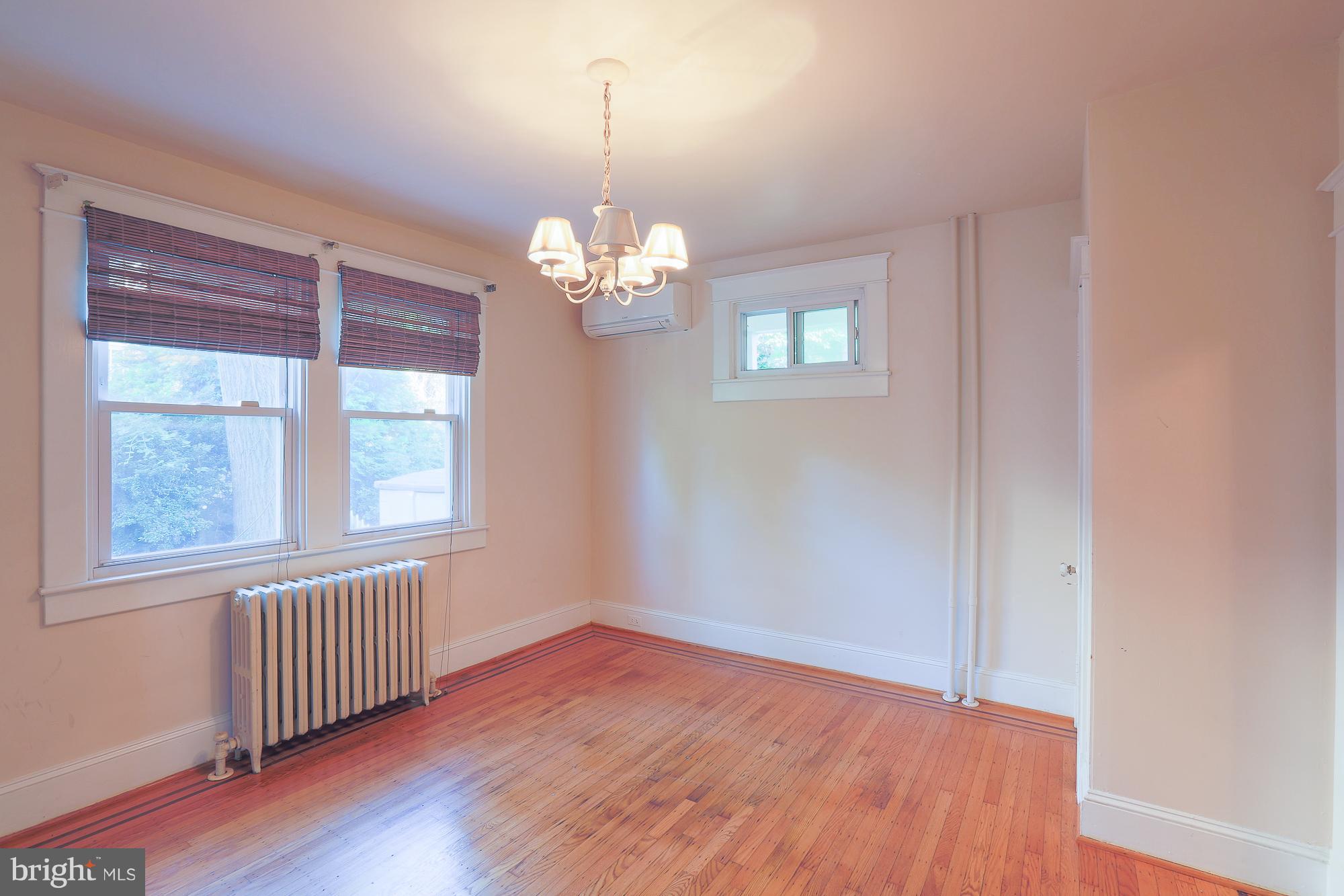 616 St Johns Road Baltimore, MD 21210 - Photo 10 of 15 a view of empty room with wooden floor and fan