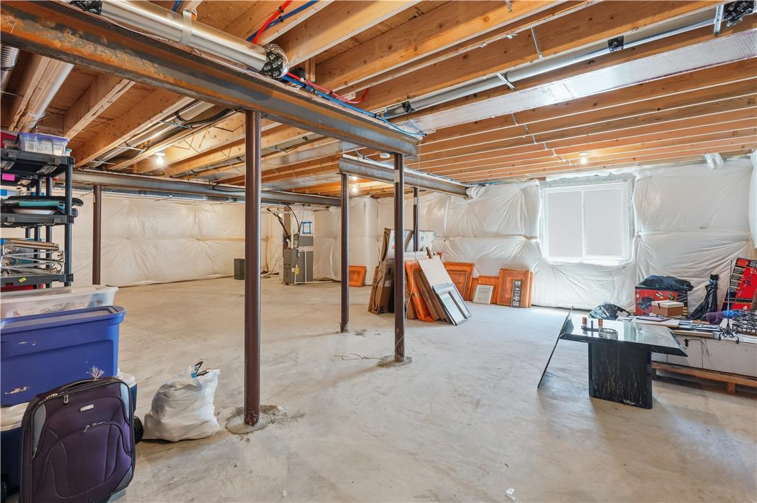 4120 Eveningstar Road Emmaus, PA 18049 - Photo 46 of 62 Unfinished basement with exposed beams awaits your personalized touch and creative vision.