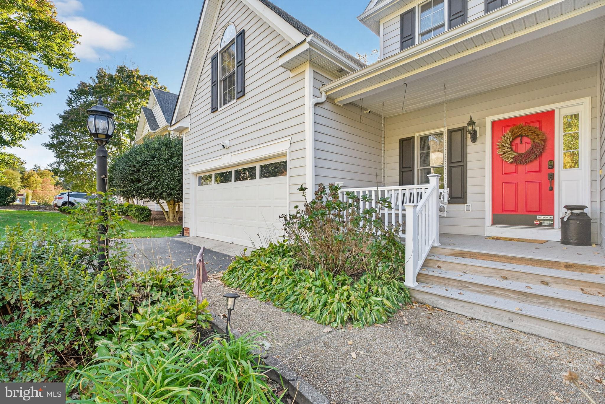 8518 Easton Ridge Place Chesterfield, VA 23832 - Photo 3 of 48 Charming entrance with vibrant red door.