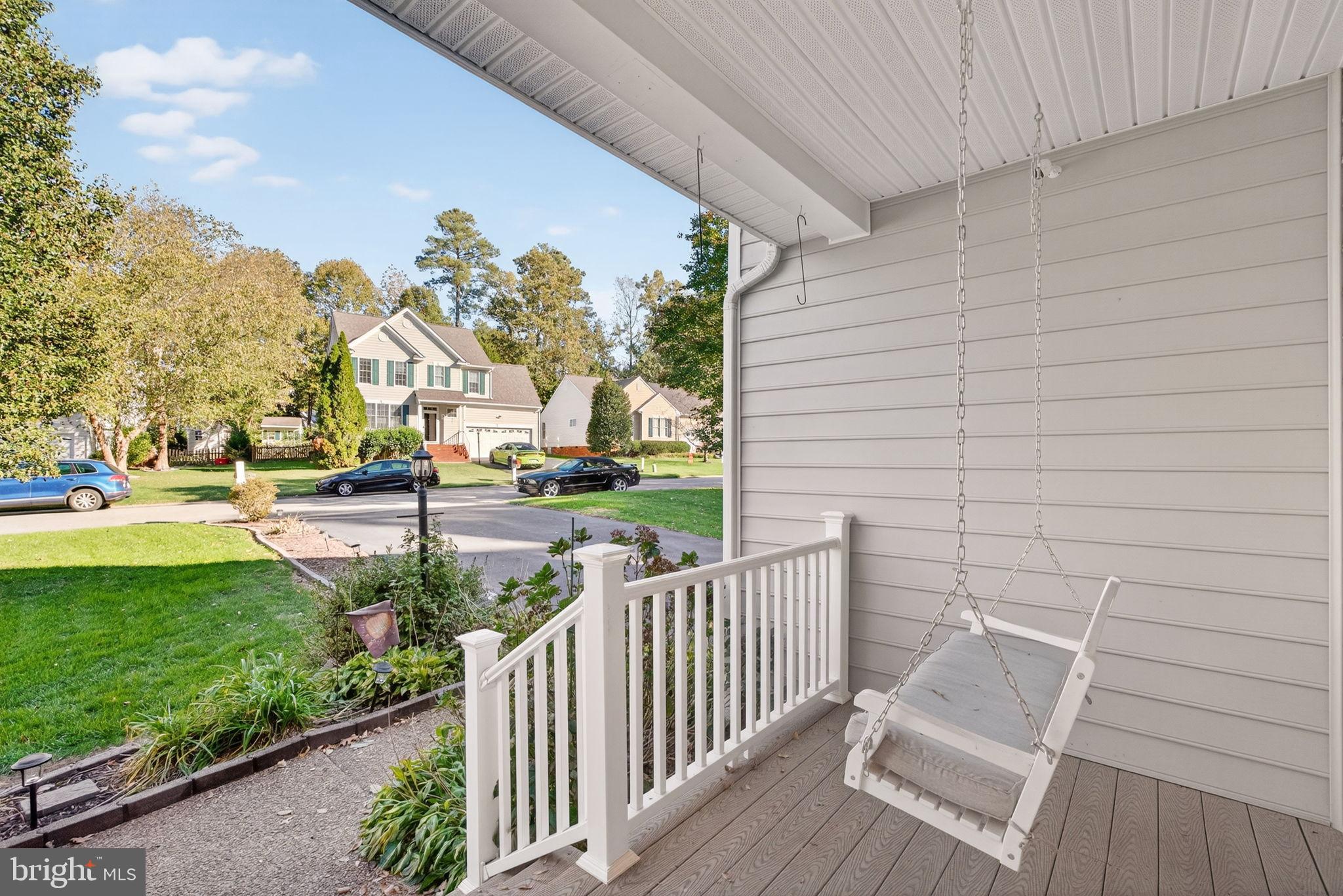 8518 Easton Ridge Place Chesterfield, VA 23832 - Photo 7 of 48 Charming porch swing with serene views.