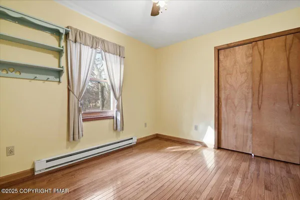 a view of front door with wooden floor