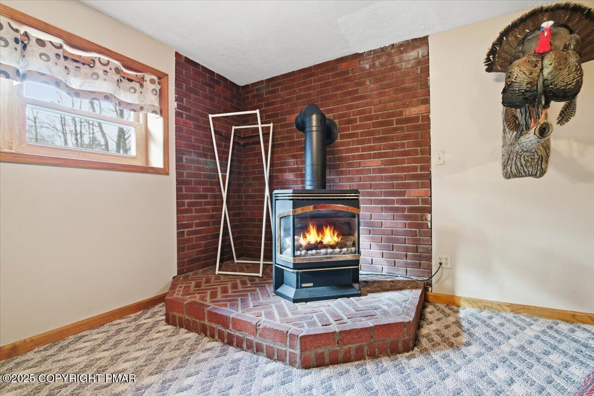 1304 Summit View Drive Long Pond, PA 18334 - Photo 31 of 51 a living room with furniture and a flat screen tv