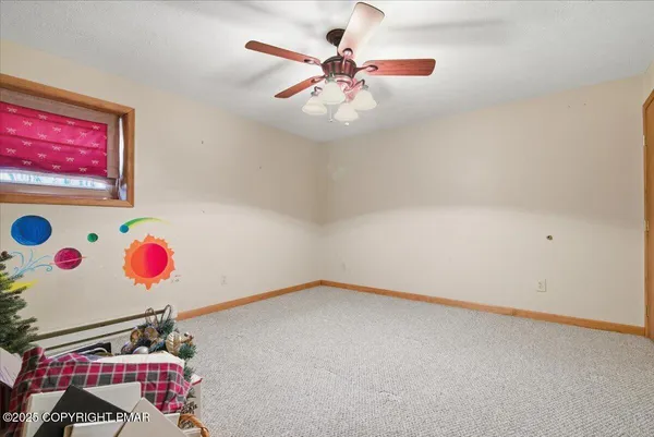 a view of an room with a fan