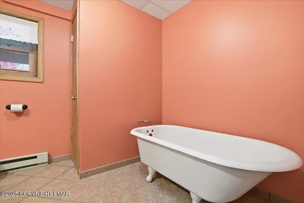 a white bath tub sitting in a bathroom
