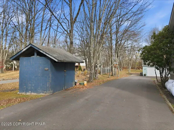 a view of a house with a snow and yard