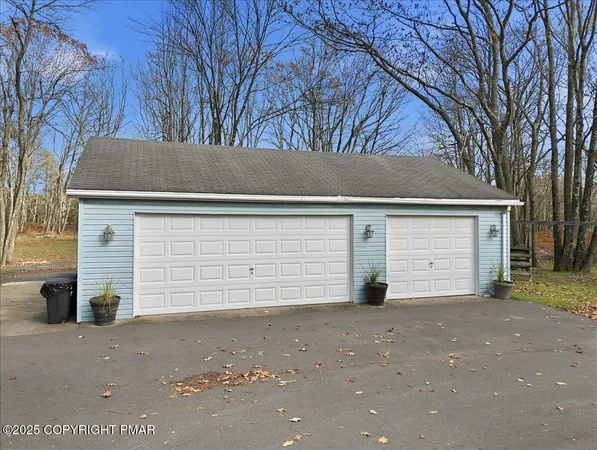 a view of garage and yard
