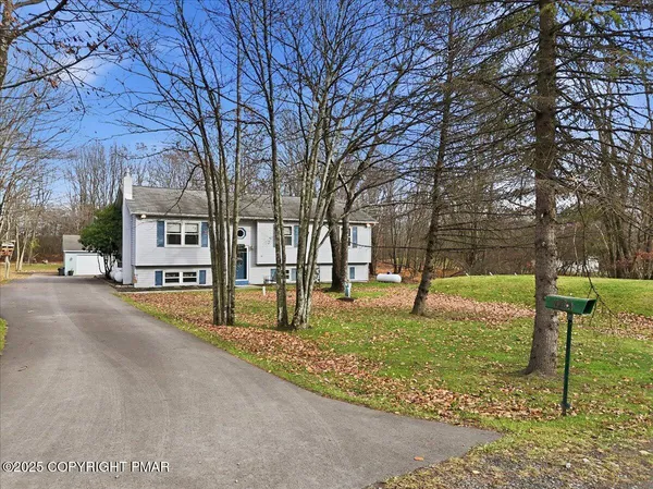 a house with trees in front of it