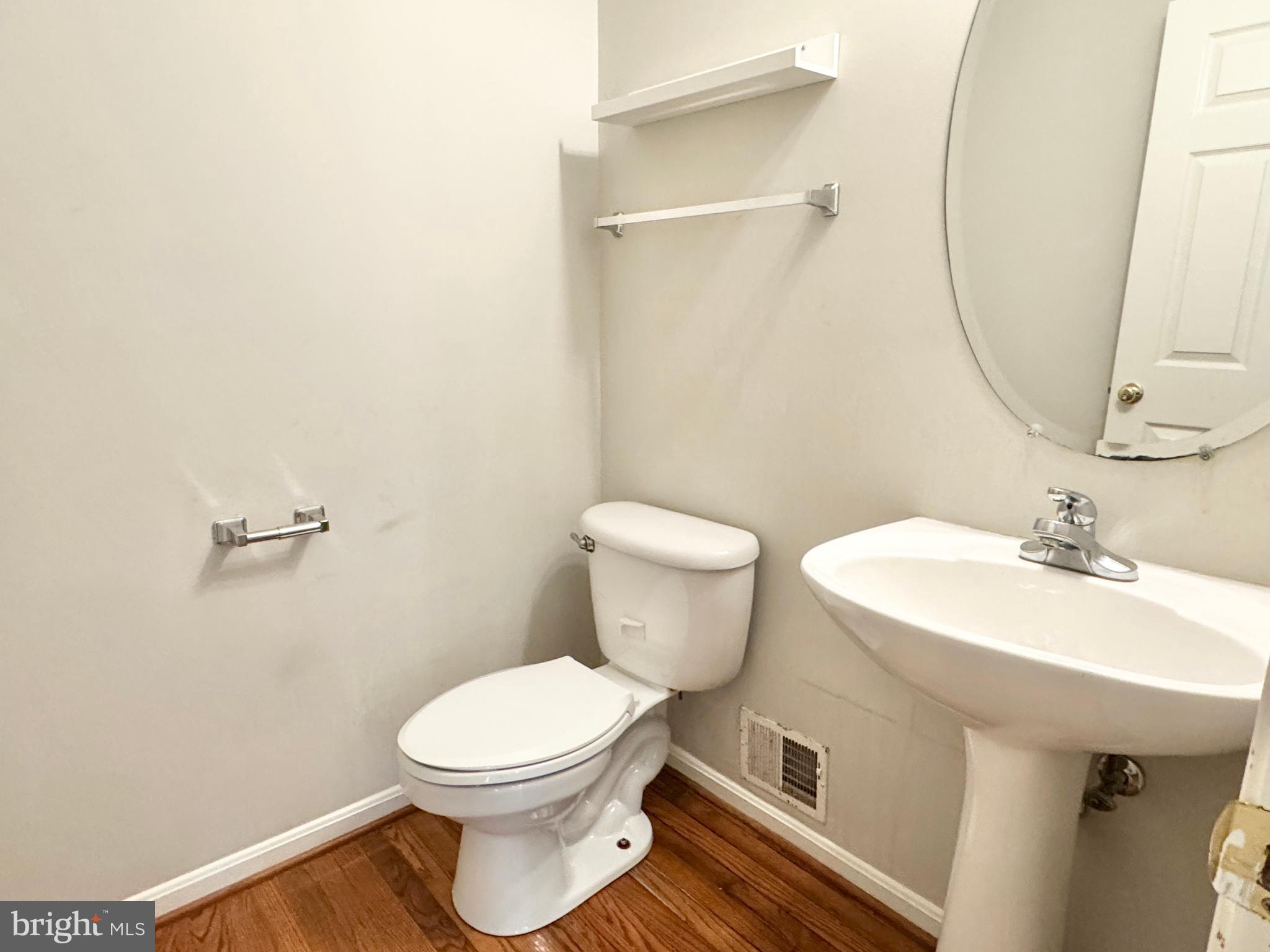 3721 Katie Place Triangle, VA 22172 - Photo 15 of 39 a bathroom with a toilet sink and mirror