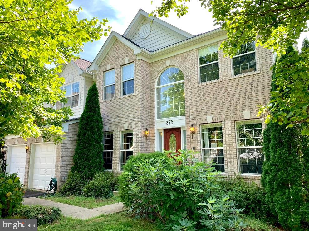 3721 Katie Place Triangle, VA 22172 - Photo 2 of 39 a front view of a house with garden