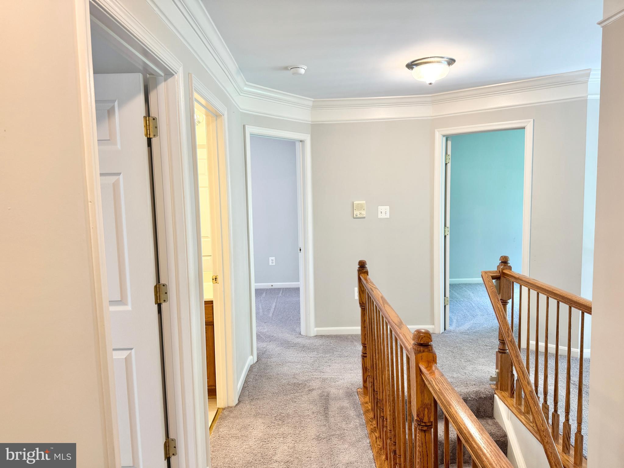 3721 Katie Place Triangle, VA 22172 - Photo 21 of 39 a view of a hallway with wooden floor and staircase