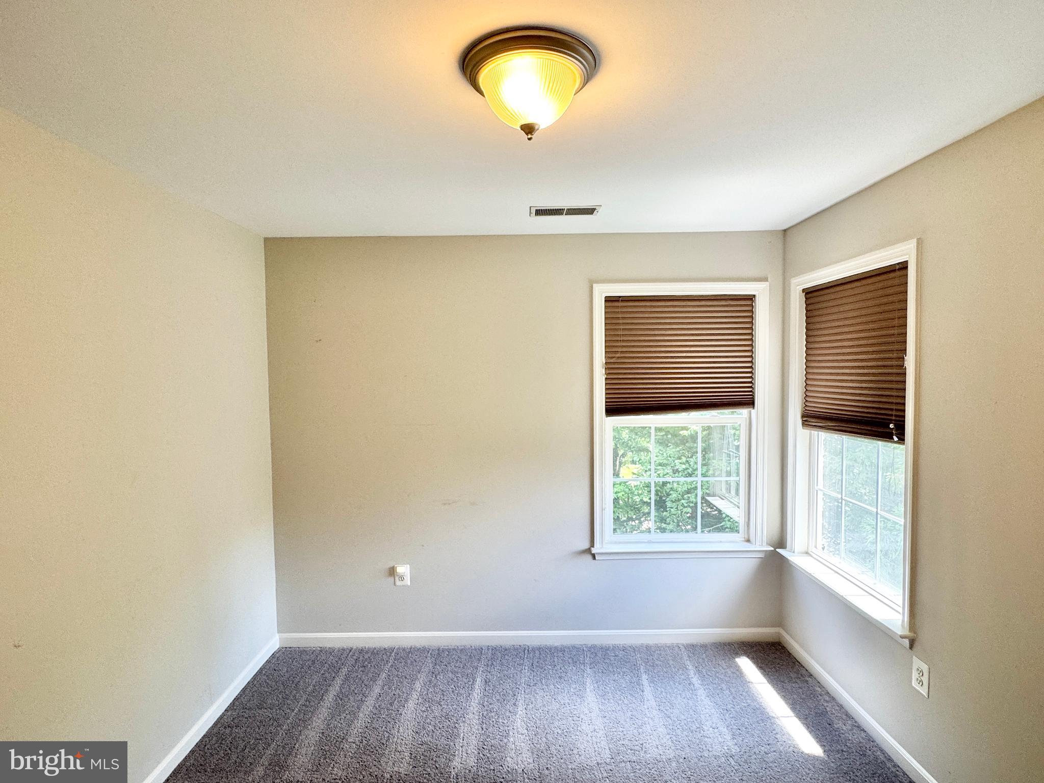 3721 Katie Place Triangle, VA 22172 - Photo 25 of 39 an empty room with wooden floor and windows