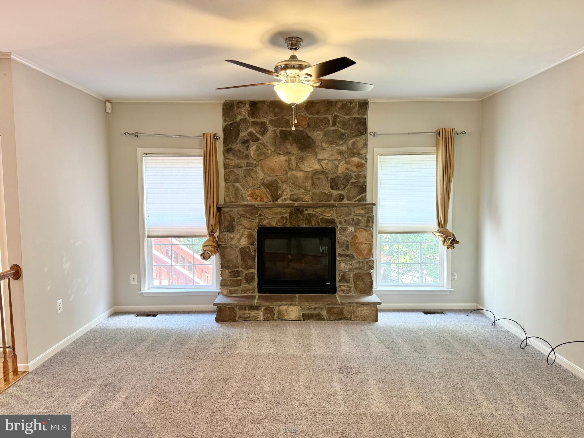 3721 Katie Place Triangle, VA 22172 - Photo 3 of 39 an empty room with fireplace and windows