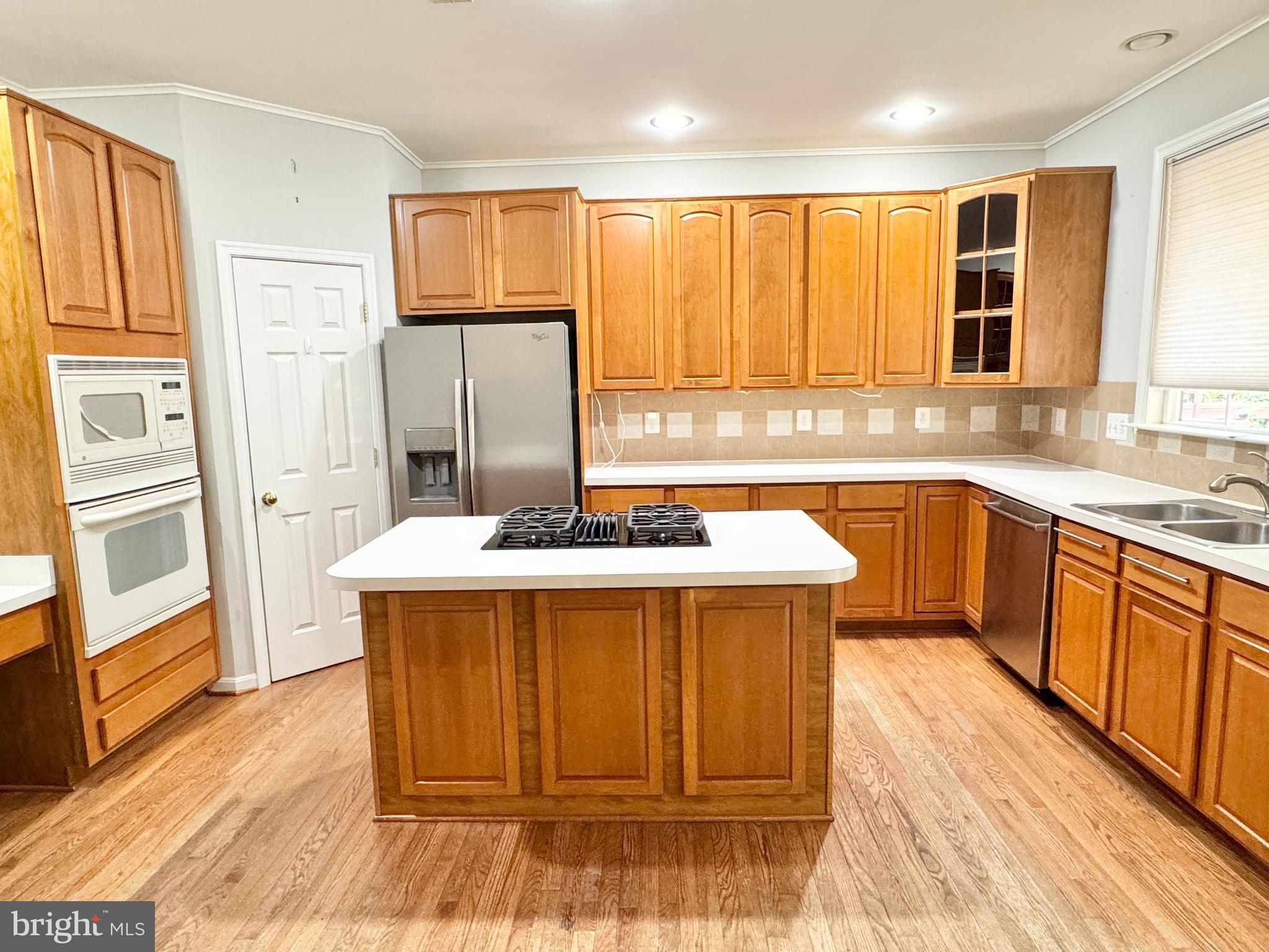 3721 Katie Place Triangle, VA 22172 - Photo 7 of 39 a kitchen with a sink stove and refrigerator