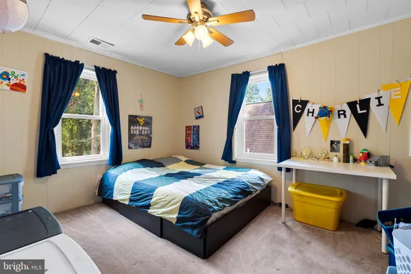 a bedroom with a bed and window