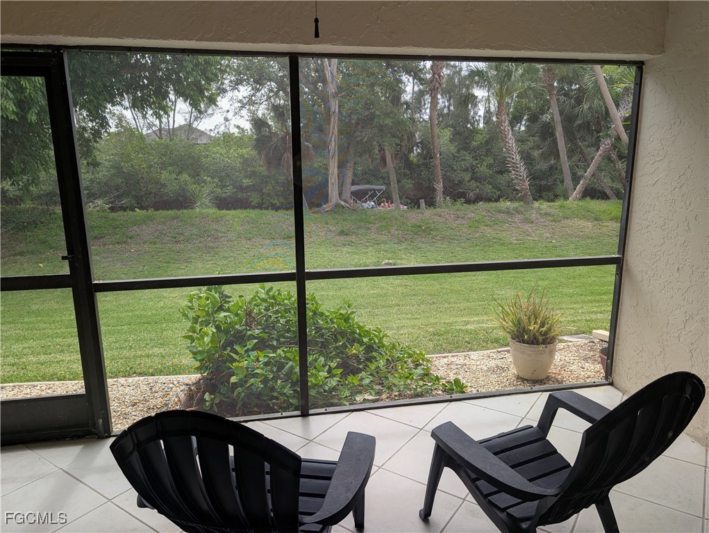 a view of a lot of furniture and floor to ceiling window