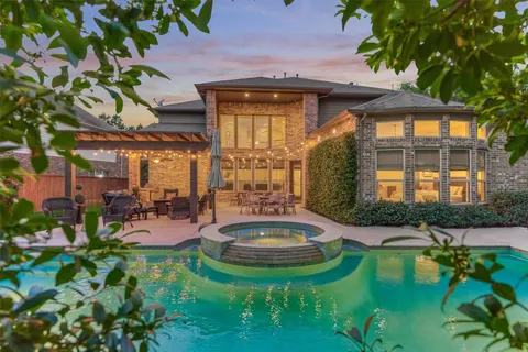 a view of a swimming pool with outdoor seating