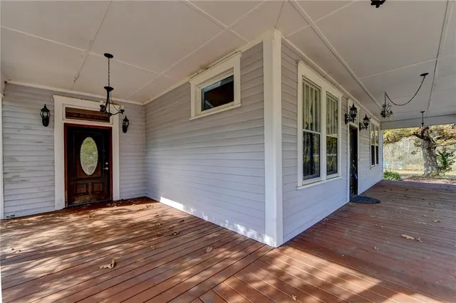 a view of livingroom with furniture hardwood floor and a ceiling fan