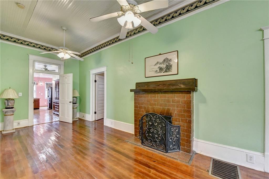 221 Plainview Road Jefferson, GA 30549 - Photo 15 of 87 a view of an empty room with wooden floor and a fireplace