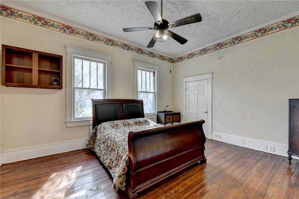 221 Plainview Road Jefferson, GA 30549 - Photo 25 of 87 a bedroom with a bed and a ceiling fan