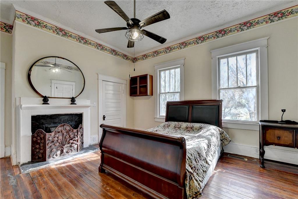 221 Plainview Road Jefferson, GA 30549 - Photo 26 of 87 a bed room with a bed and a fireplace