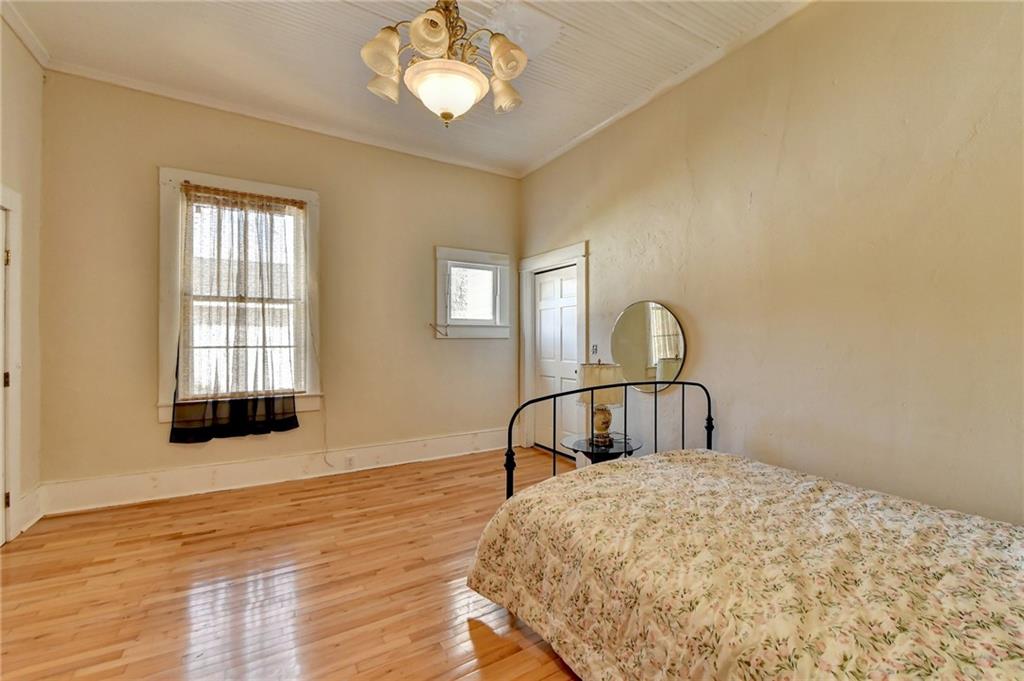 221 Plainview Road Jefferson, GA 30549 - Photo 30 of 87 a bedroom with a bed and a dresser with wooden floor