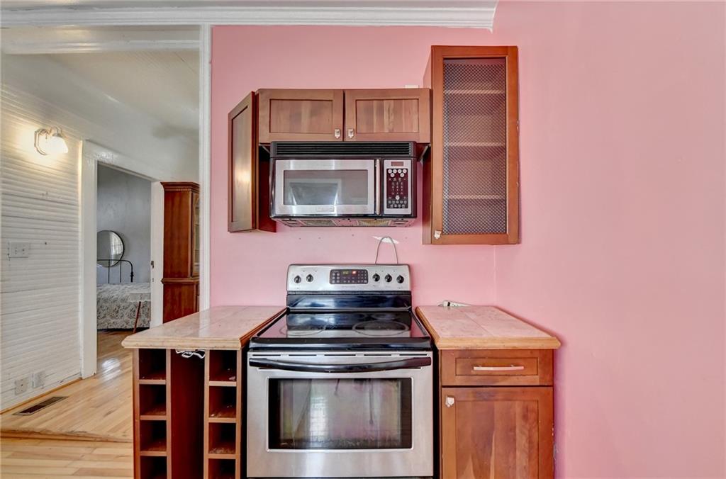 221 Plainview Road Jefferson, GA 30549 - Photo 36 of 87 a kitchen with a stove and a microwave