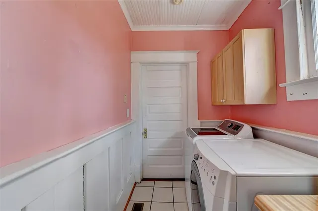 a view of a house with wooden fence